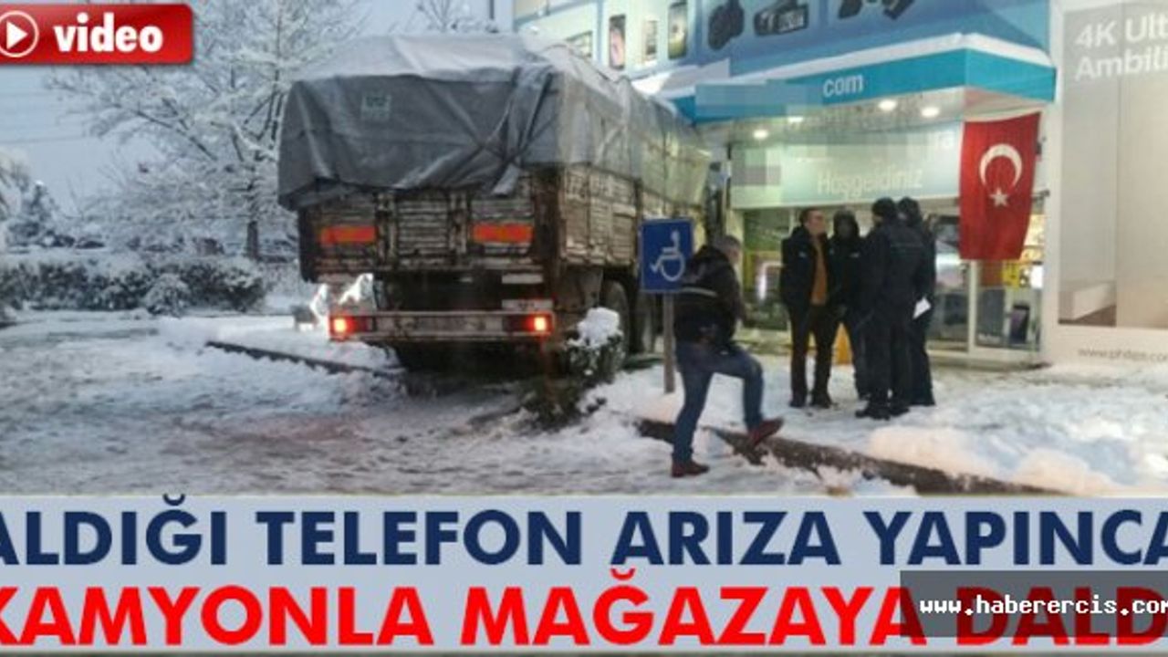 Telefonu arıza yapınca, mağazaya kamyonla daldı